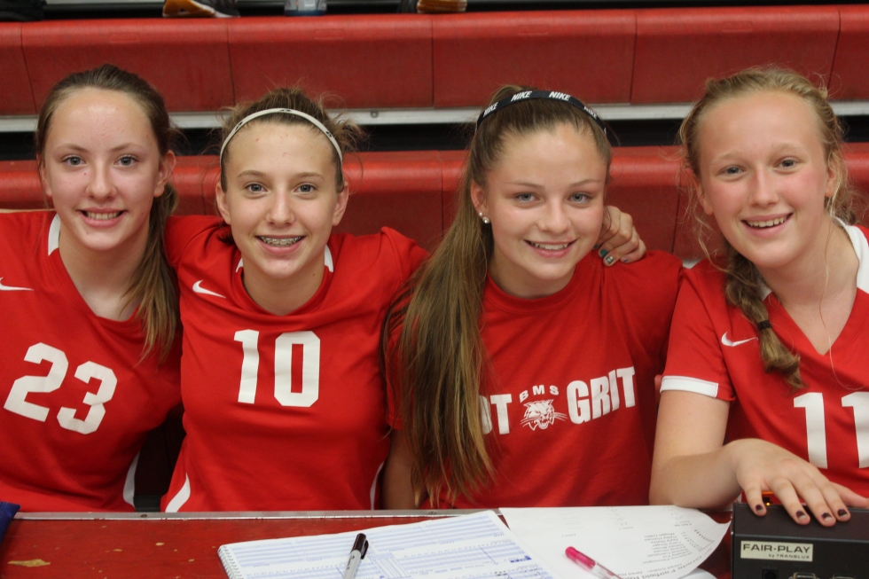 girl athletes taking group picture