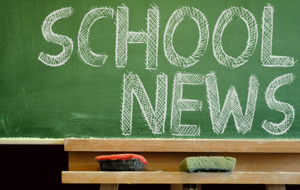 Chalk board that says 'school news'