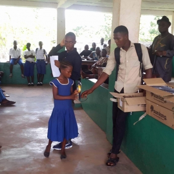 Student receiving solar lantern