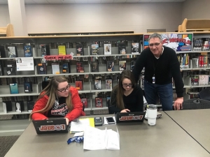 students and volunteers learn tax prep
