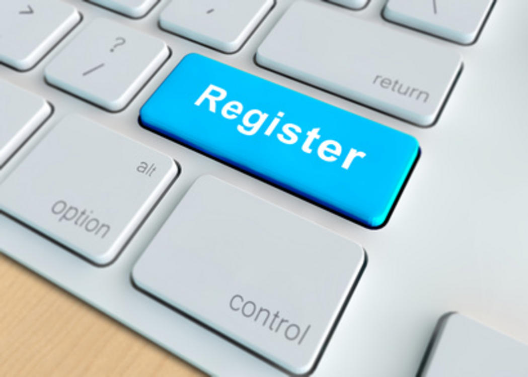 Computer keyboard with blue key that says registration