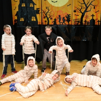 students dressed as mummies for Halloween show