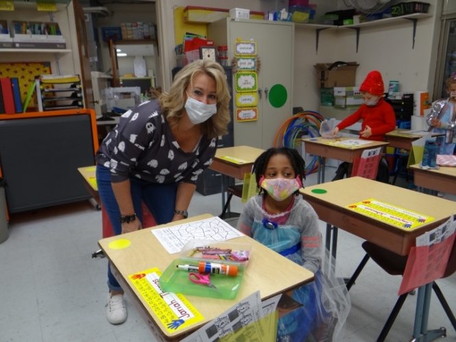 student and teacher in classroom