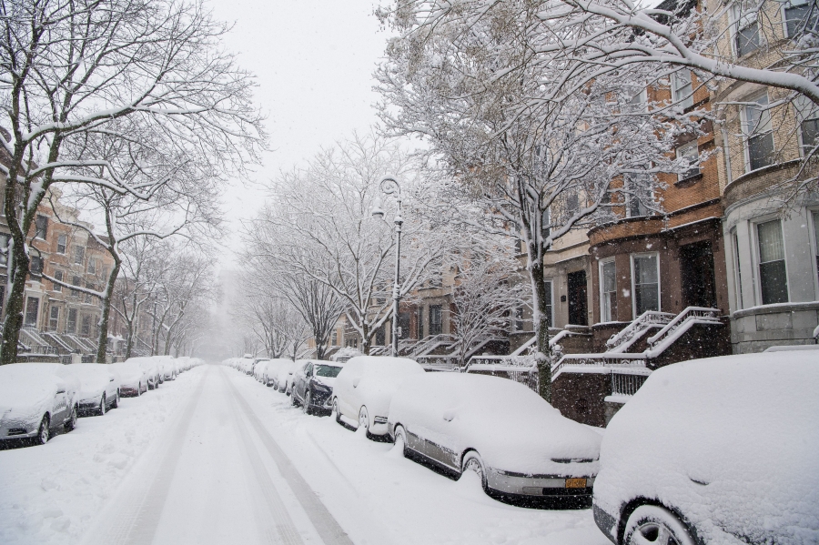 Residential street covered in snow